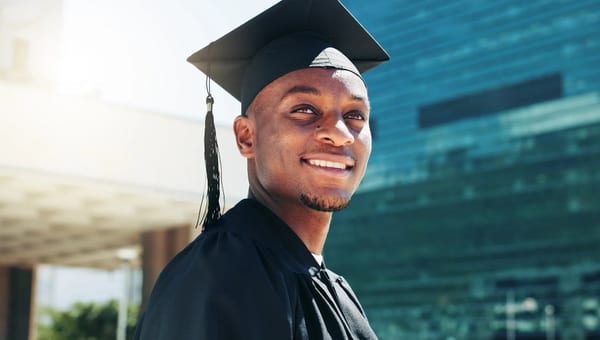 Graduate smiling at scholarship ceremony